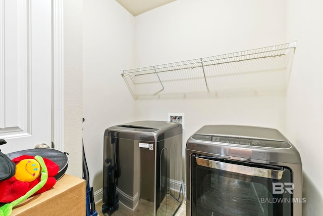 laundry room featuring washing machine and dryer