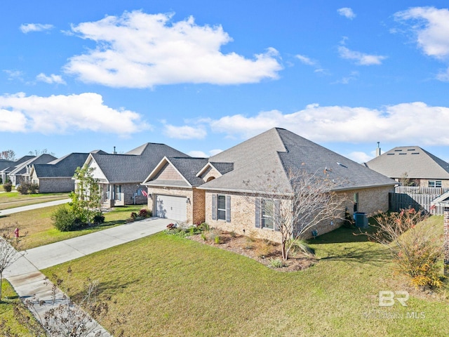 view of front of house featuring a garage, a front yard, and central AC