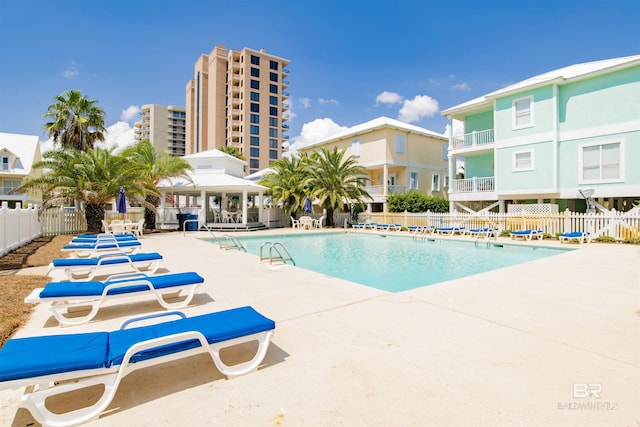 view of swimming pool featuring a gazebo and a patio