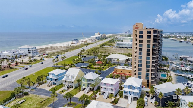 bird's eye view featuring a water view and a view of the beach