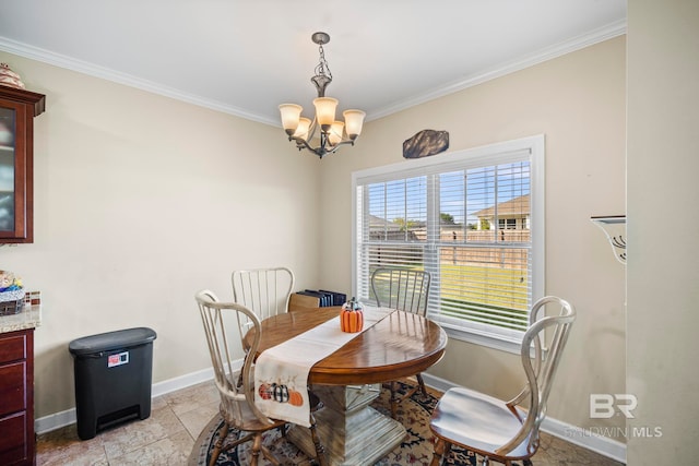 dining area with crown molding and a notable chandelier