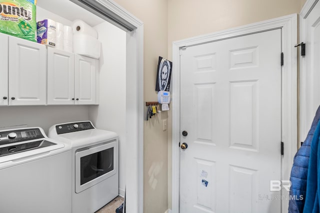 laundry area with cabinets and separate washer and dryer