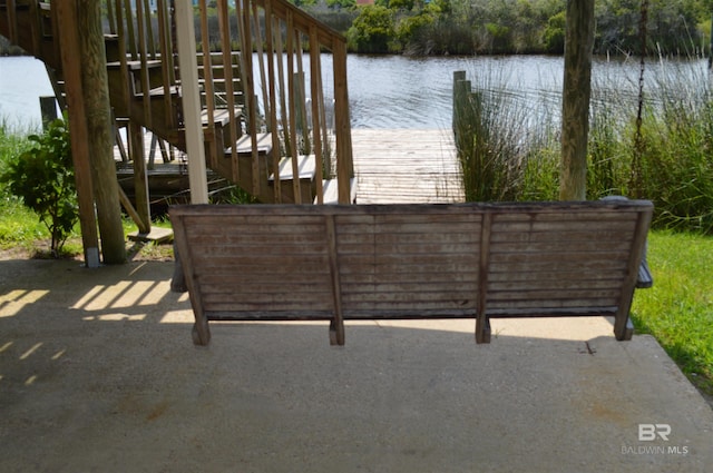 220 Shoreland Cir, Gulf Shores, AL 36542 - exterior space with a boat dock and a water view