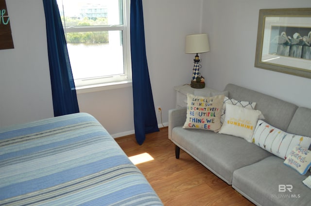 220 Shoreland Cir, Gulf Shores, AL 36542 - bedroom with hardwood / wood-style flooring