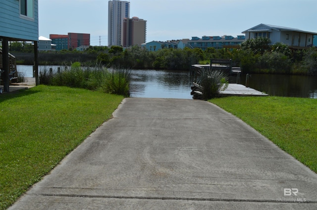 220 Shoreland Cir, Gulf Shores, AL 36542 - property view of water featuring a boat dock