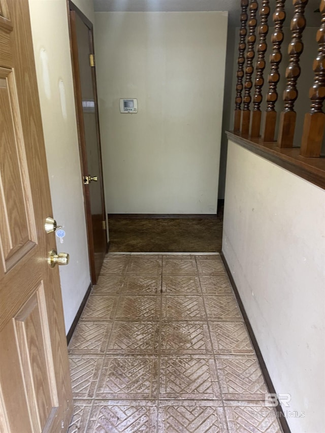8115 Centeridge Dr, Wilmer, AL 36587 - hall with baseboards and brick patterned flooring