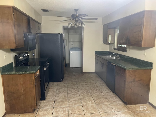 8115 Centeridge Dr, Wilmer, AL 36587 - kitchen featuring black appliances, washer / clothes dryer, ceiling fan, dark countertops, and a sink
