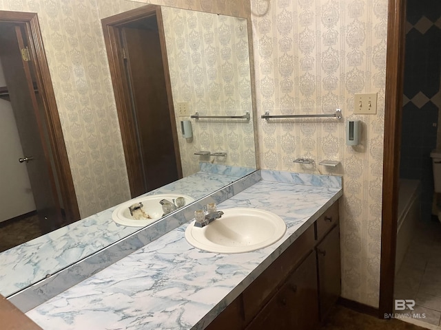 8115 Centeridge Dr, Wilmer, AL 36587 - bathroom with vanity and wallpapered walls
