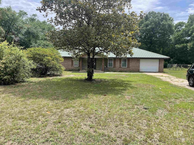 8115 Centeridge Dr, Wilmer, AL 36587 - ranch-style house with an attached garage, driveway, brick siding, and metal roof