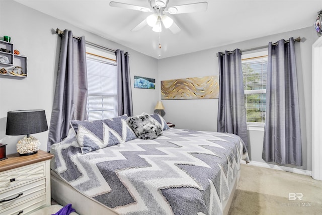 310 W 3rd Ave, Gulf Shores, AL 36542 - bedroom featuring baseboards, a ceiling fan, and light carpet