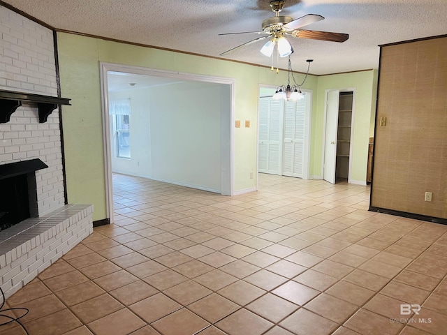 6120 Appaloosa Dr, Mobile, AL 36693 - unfurnished living room with crown molding, a textured ceiling, ceiling fan, light tile patterned flooring, and a brick fireplace