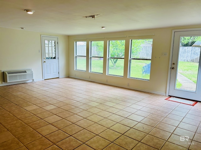 6120 Appaloosa Dr, Mobile, AL 36693 - doorway to outside featuring light tile patterned flooring, a wall mounted air conditioner, and baseboards
