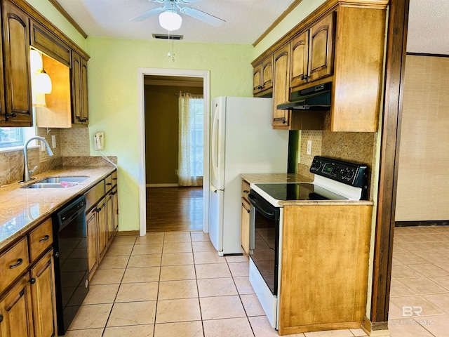 6120 Appaloosa Dr, Mobile, AL 36693 - kitchen featuring range with electric stovetop, under cabinet range hood, a sink, black dishwasher, and light tile patterned floors