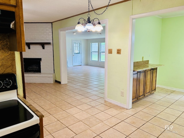 6120 Appaloosa Dr, Mobile, AL 36693 - kitchen with electric range, ornamental molding, light tile patterned floors, a chandelier, and baseboards