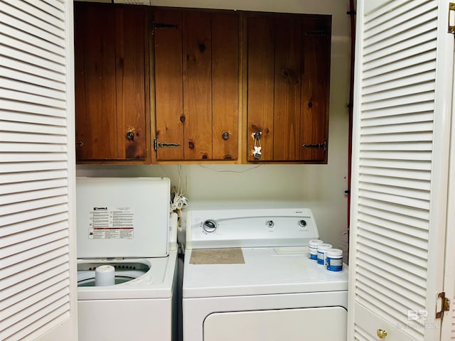 6120 Appaloosa Dr, Mobile, AL 36693 - laundry room featuring washing machine and clothes dryer and cabinet space