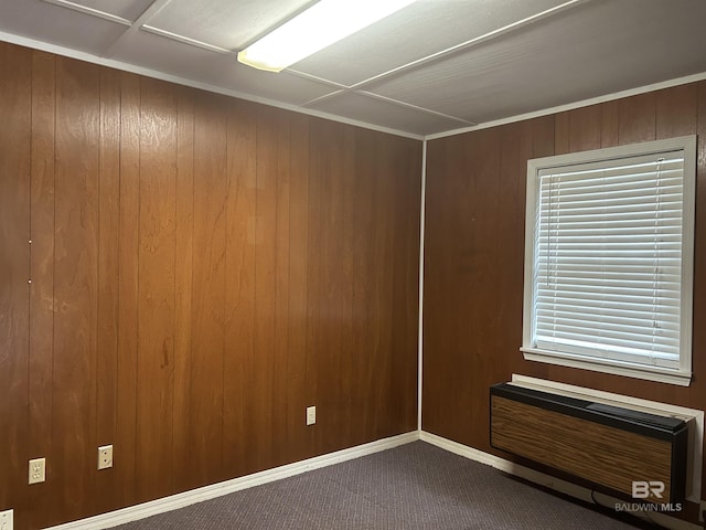 6120 Appaloosa Dr, Mobile, AL 36693 - spare room with dark carpet, wood walls, a wall mounted AC, and baseboards