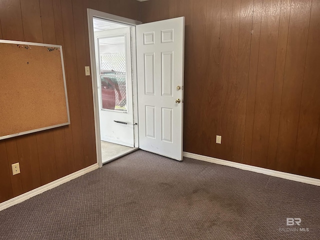 6120 Appaloosa Dr, Mobile, AL 36693 - spare room featuring carpet flooring, wooden walls, and baseboards