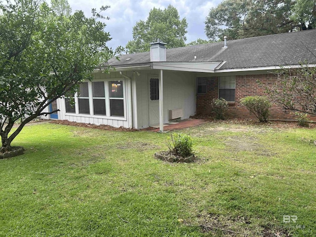 6120 Appaloosa Dr, Mobile, AL 36693 - back of property featuring a chimney, a lawn, roof with shingles, and brick siding