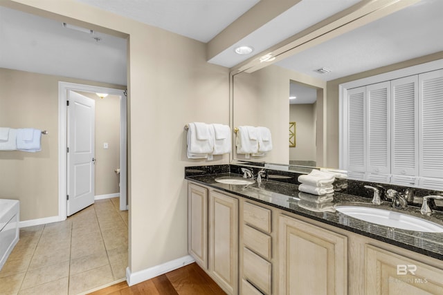 527 E Beach Blvd Unit 802, Gulf Shores, AL 36542 - bathroom featuring double vanity and a closet