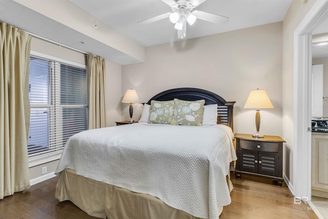 527 E Beach Blvd Unit 802, Gulf Shores, AL 36542 - bedroom with wood finished floors and a ceiling fan