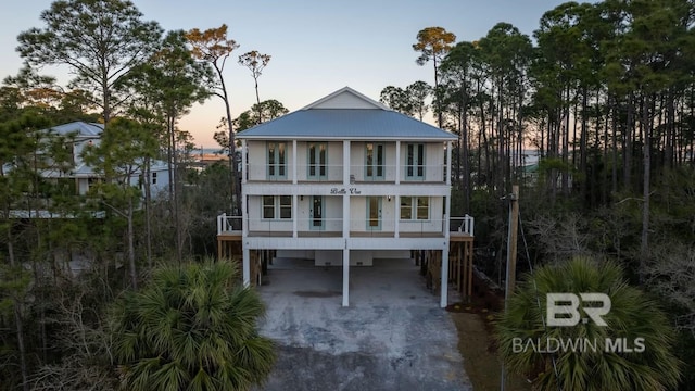 1438 Bienville Blvd Unit B, Dauphin Island, AL 36528 - beach home featuring a carport, a balcony, and driveway