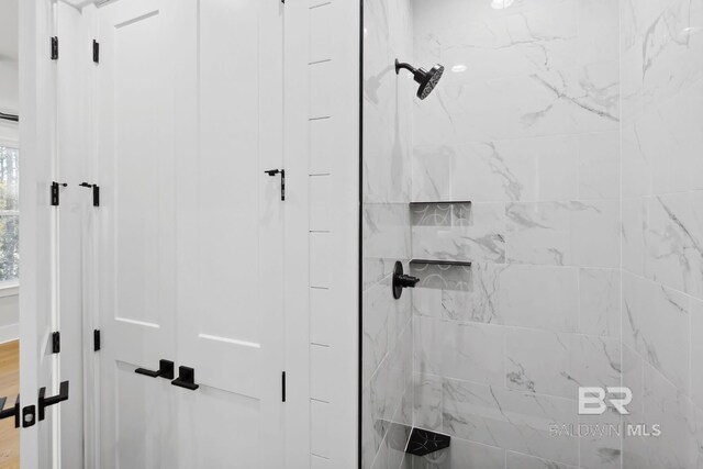 1438 Bienville Blvd Unit B, Dauphin Island, AL 36528 - bathroom featuring a marble finish shower