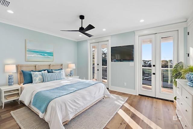 1438 Bienville Blvd Unit B, Dauphin Island, AL 36528 - bedroom with french doors, access to exterior, ornamental molding, recessed lighting, and light wood-type flooring