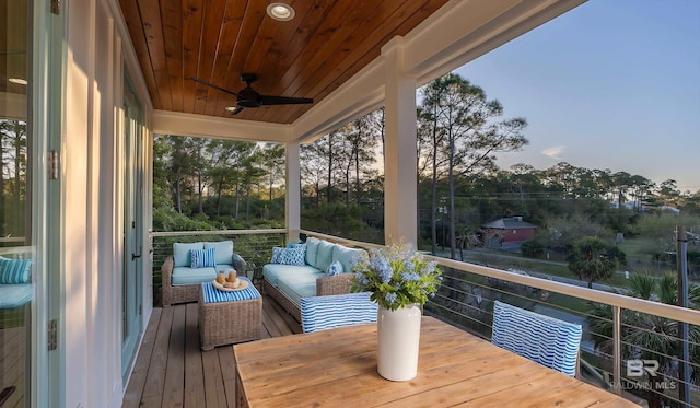 1438 Bienville Blvd Unit B, Dauphin Island, AL 36528 - wooden terrace featuring a ceiling fan and an outdoor hangout area
