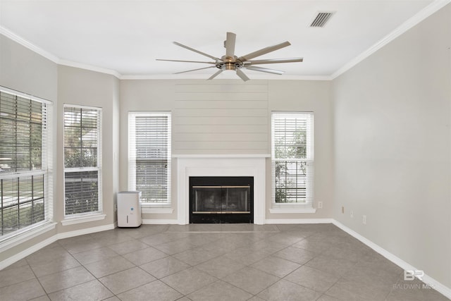 unfurnished living room featuring tile patterned floors, ceiling fan, and crown molding