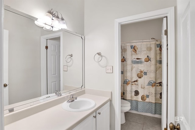 bathroom featuring tile patterned floors, vanity, a shower with shower curtain, and toilet