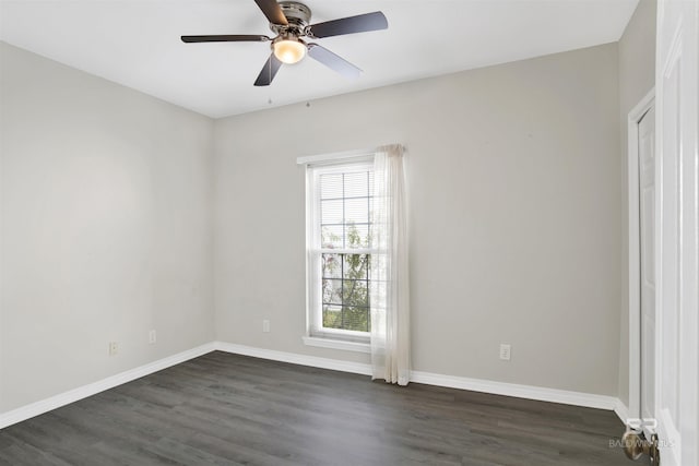 empty room with dark hardwood / wood-style floors and ceiling fan