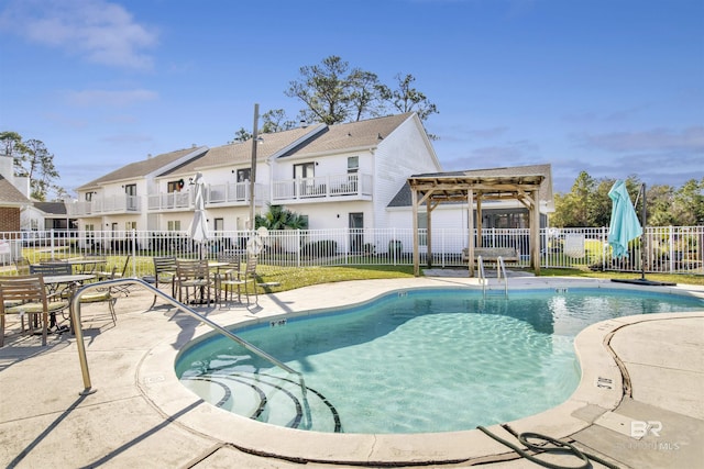 view of swimming pool with a patio