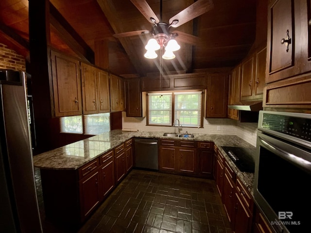 kitchen with sink, stainless steel appliances, light stone counters, lofted ceiling with beams, and kitchen peninsula