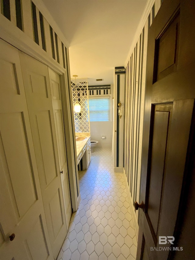 hallway with ornamental molding