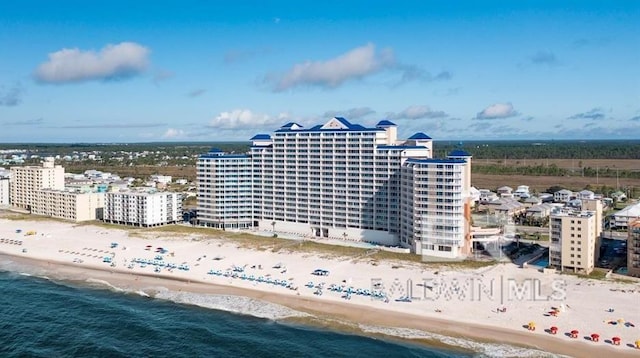 aerial view featuring a water view and a view of the beach