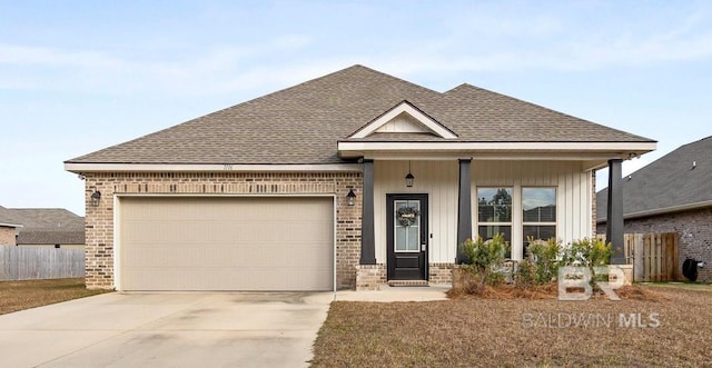 view of front of house with a garage and a porch