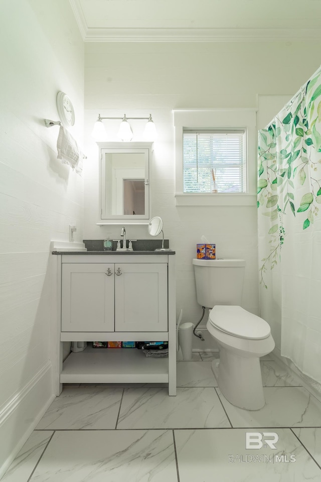 bathroom with ornamental molding, vanity, tile patterned floors, toilet, and walk in shower