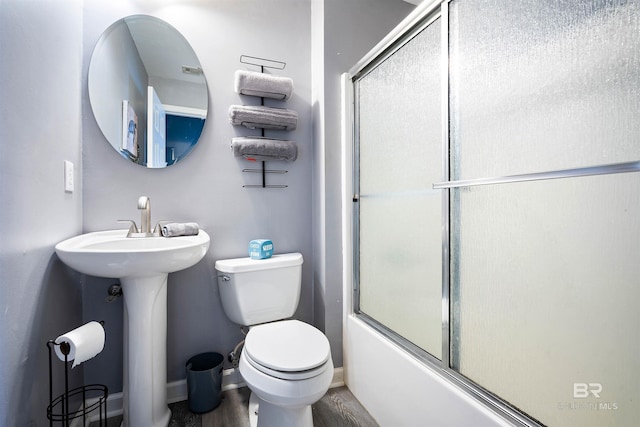 4 Yacht Club Dr, Daphne, AL 36526 - full bathroom featuring toilet, combined bath / shower with glass door, wood finished floors, and baseboards