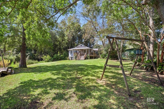 view of yard featuring a wooden deck