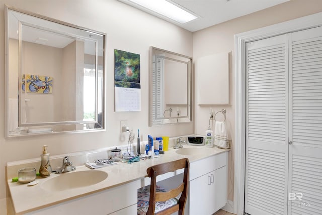 bathroom featuring dual vanity