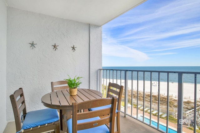 balcony with a view of the beach and a water view