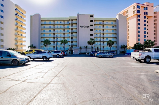 view of building exterior featuring uncovered parking