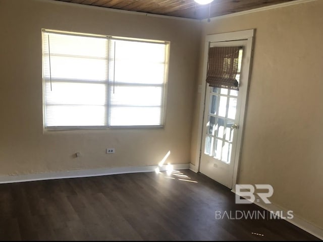 empty room featuring ceiling fan, wood ceiling, dark hardwood / wood-style floors, and ornamental molding