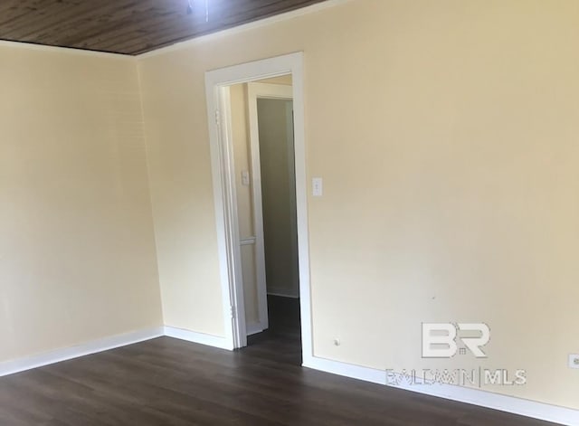 unfurnished room with dark hardwood / wood-style floors