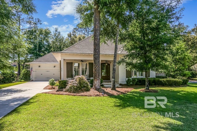 view of front of home featuring a front yard, ceiling fan, an attached garage, concrete driveway, and a shingled roof