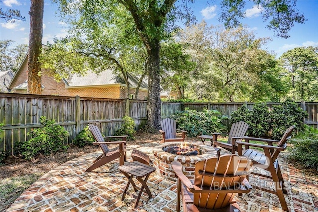 view of patio / terrace featuring a fenced backyard and a fire pit