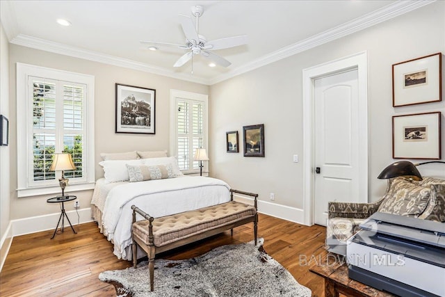 bedroom with wood finished floors, baseboards, ornamental molding, recessed lighting, and ceiling fan