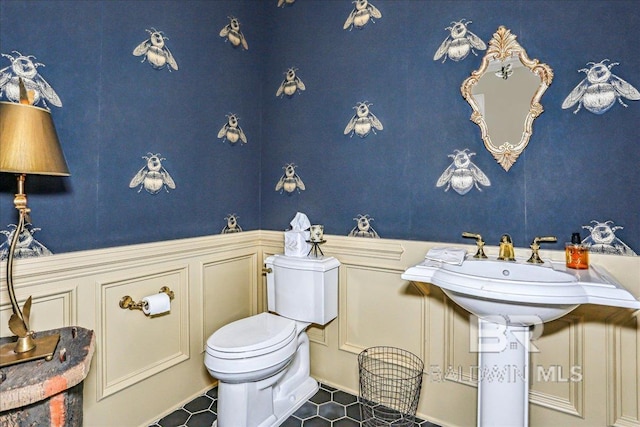 bathroom with tile patterned floors and toilet