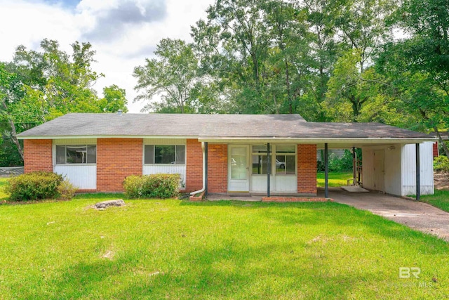 single story home featuring a carport, covered porch, and a front lawn