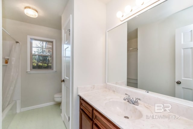 full bathroom featuring vanity, shower / tub combo with curtain, and toilet